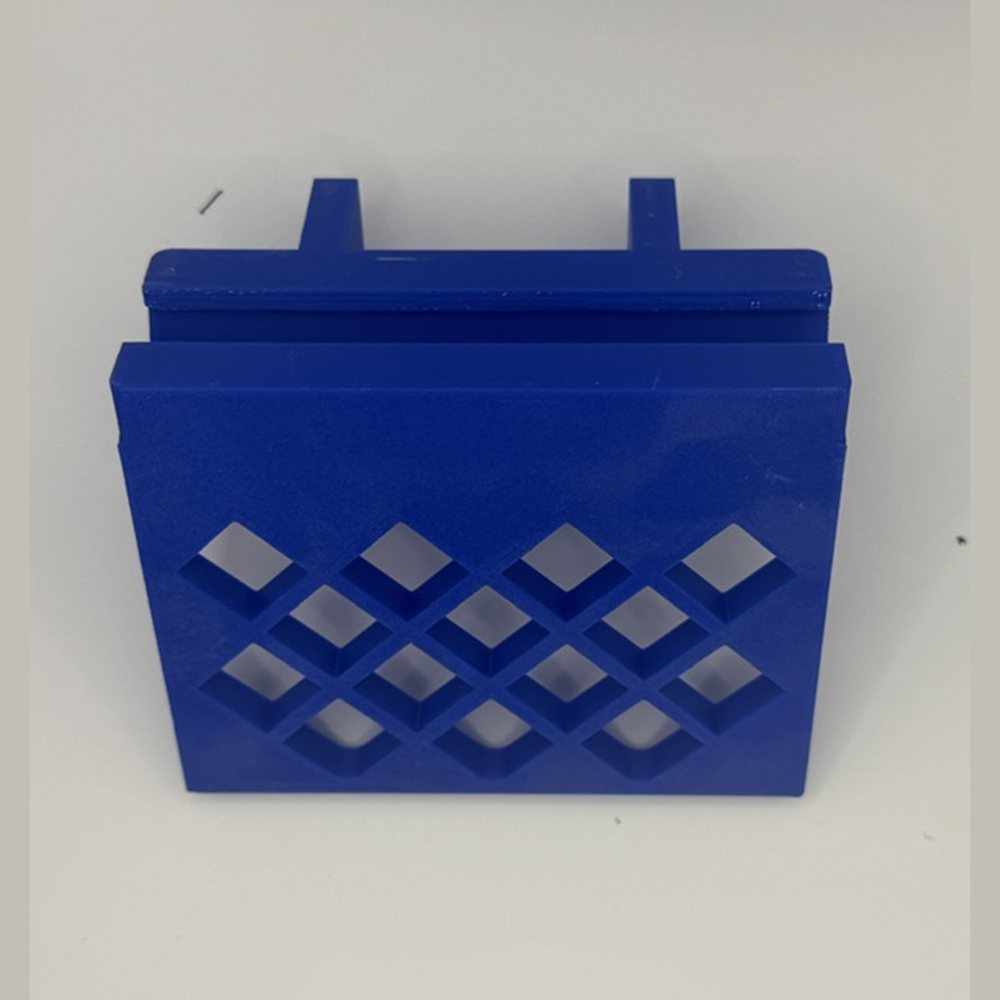 Blue Rail Attachment Shelf with a diamond cutout pattern and mounting pegs